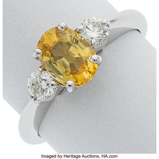 Yellow Sapphire, Diamond, White Gold Ring Stones: Oval-shaped yellow...