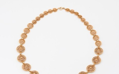Yellow gold necklace (750) with round filigree links and falling white pearl seeds.