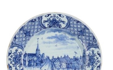 26-Delft: an earthenware plate with blue monochrome decoration of a...
