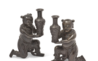 A PAIR OF CHINESE BRONZE TRIBUTE BEARERS, 17TH-18TH CENTURY