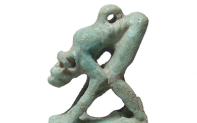 Egyptian faience amulet of an emaciated monkey