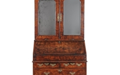 A George I walnut and featherbanded bureau bookcase