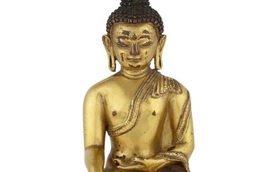 A GILT-BRONZE FIGURE OF BUDDHA VAJRASANA, TIBET, 16TH CENTURY