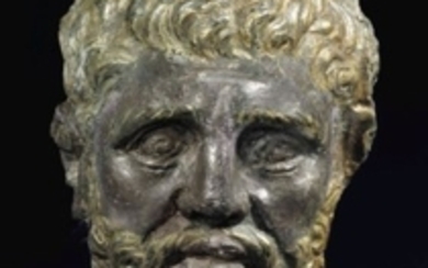 A GREEK PARCEL GILT SILVER HEAD OF A BEARDED MAN, HELLENISTIC PERIOD, CIRCA 3RD CENTURY B.C.