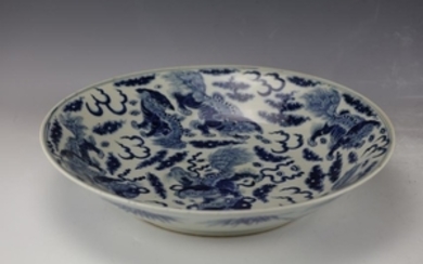 A Large Blue and White Nine Lions Deep Dish of Qing