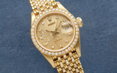 Rolex. A lady's 18K gold and diamond set automatic calendar bracelet watch