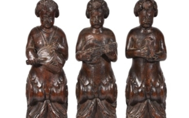 Three northern European carved term figures of musicians