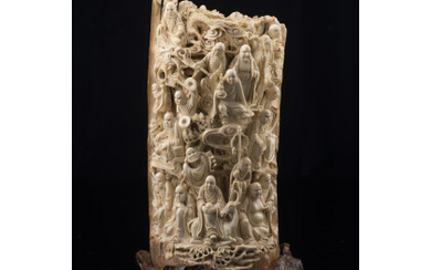 A tusk section carved with figures, wood base China, early 20th century (h.24.5 cm.)