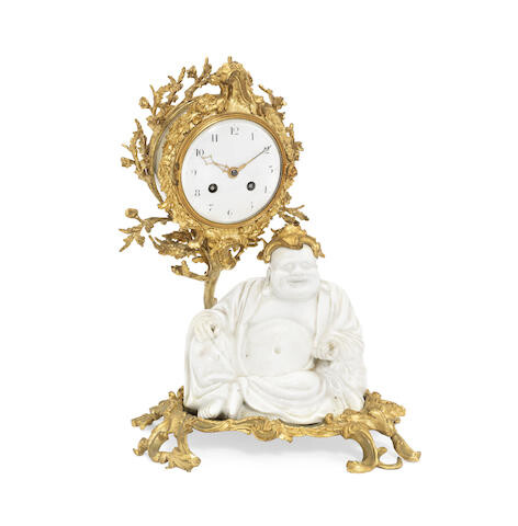A late 19th century French gilt bronze and 'blanc-de-chine' porcelain figural mantel clock