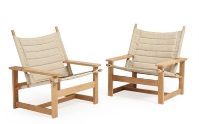 Danish furniture design: A pair of solid oak easy chairs, seat and back with canvas. 1960s. (2)