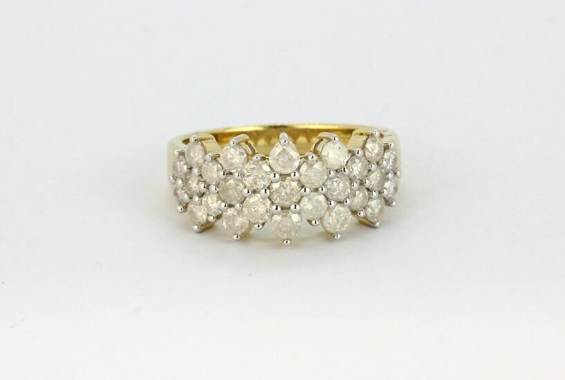 A 10ct yellow gold (stamped 10k) ring set with brilliant cut diamonds, approx. 1ct overall, (O).