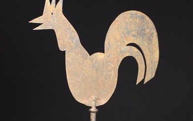 A 19th Century Sheet Iron Weather Vane silhouette cut in the form of a cockerel and revolving on a d