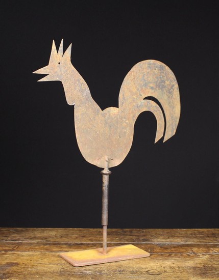 A 19th Century Sheet Iron Weather Vane silhouette cut in the form of a cockerel and revolving on a d