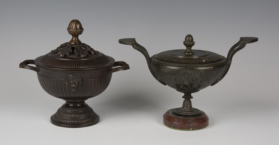 A 19th century French brown patinated cast bronze ornamental urn and cover of Classical twin-handled