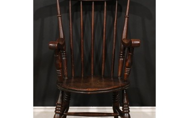 A 19th century beech and elm penny seat elbow chair, in the ...