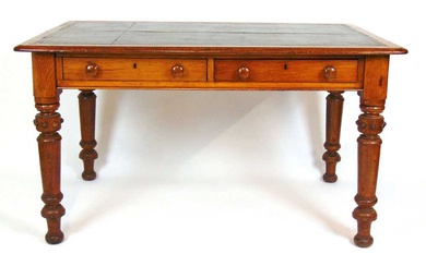 A 19th century oak library table, the top with green...
