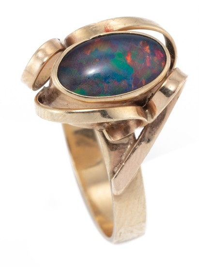 A 9CT GOLD OPAL RING; rub set with an opal triplet with applied flat wire ribbons, size O1/2, wt. 3.21g.