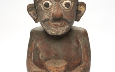 A BALINESE CARVED FIGURE OF AN ASCETIC 19TH CENTURY