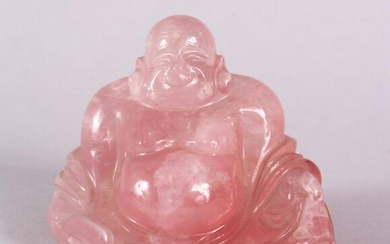 A CHINESE CARVED ROSE QUARTS FIGURE OF BUDDHA, in a