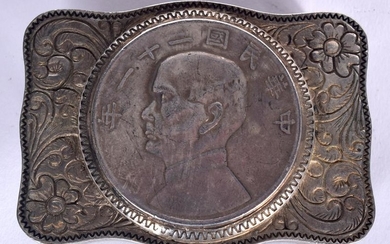 A CHINESE WHITE METAL BELT BUCKLE, decorated with a