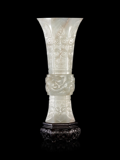 A Carved White Jade Gu Vase