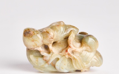 A Celadon and Russet Jade Figure of a Duck Holding Lotus, 19th Century