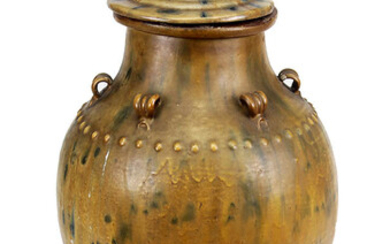 A Chinese Brown glazed stoneware storage jar with cover lion finial
