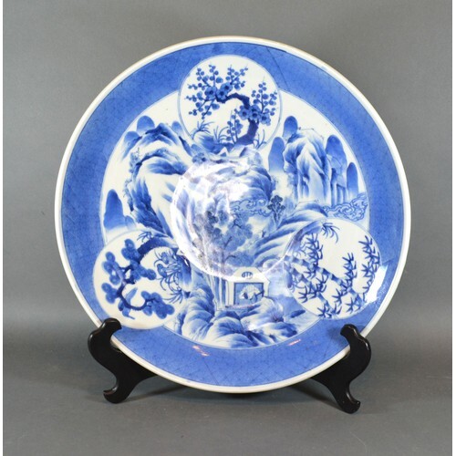 A Chinese Porcelain Charger decorated in underglaze blue, se...