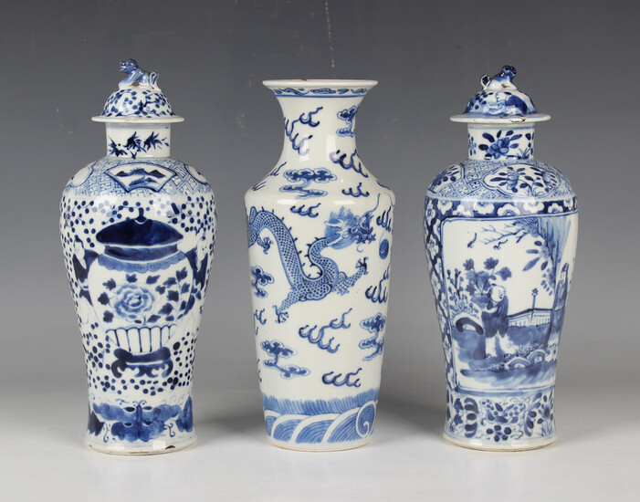A Chinese blue and white porcelain vase, mark of Kangxi but late 19th century, painted with dragons