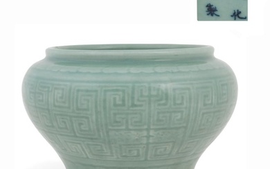 A Chinese celadon glazed porcelain urn