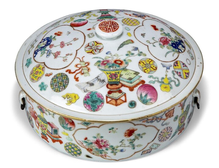 A Chinese porcelain famille rose circular box and cover, Republic period, decorated to the sides and cover with floral panels on a ground of auspicious objects and vases of flowers, 25cm diameter