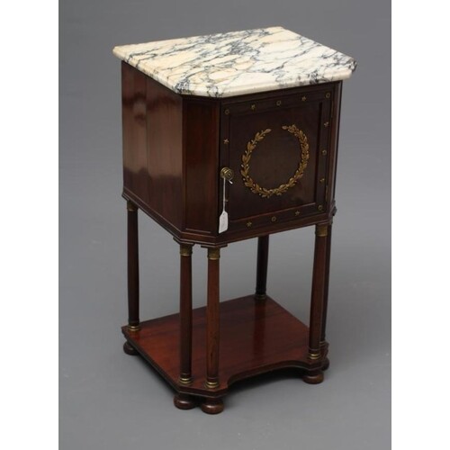 A FRENCH EMPIRE STYLE MAHOGANY BEDSIDE COMMODE of canted obl...