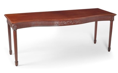 A George III style mahogany serpentine table