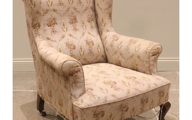A George III style wingback armchair, late 19th/early 20th c...