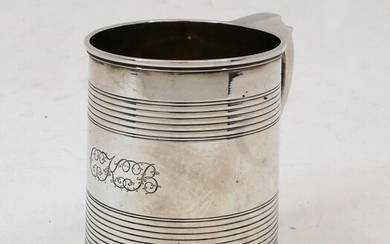 A George IV silver christening cup, London, 1929, Charles Fox II, of tapering cylindrical form with banded detail and shaped handle, having engraved initials to exterior and gilt interior, 7.6cm high, weight approx. 4.4oz