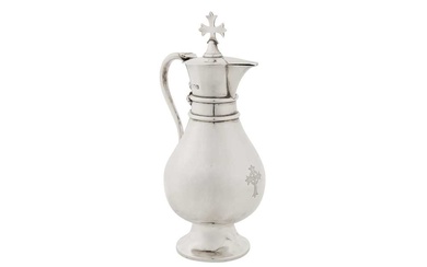 A George V sterling silver ecclesiastical wine flagon, London 1914 by J Wippell and Co Ltd