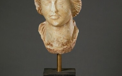 A MARBLE BUST OF A WOMAN