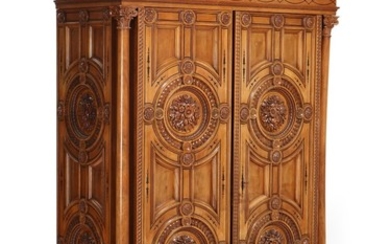 A Neo Renaissance walnut cupboard with black inlays, richly carved with flowers and foliage. Circa 1875. H. 250. W. 144. D. 67 cm.