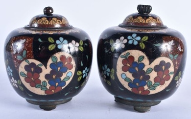 A PAIR OF 19TH CENTURY JAPANESE MEIJI PERIOD CLOISONNE ENAMEL JARS AND COVERS decorated with foliage
