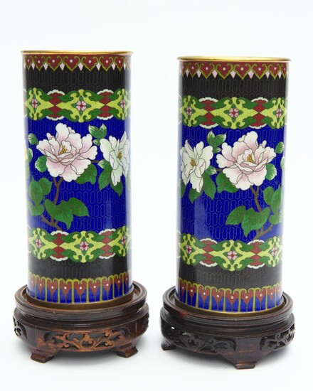 A PAIR OF CHINESE CLOISONNE VASES OF CYLINDER FORM ON CARVED WOODEN BASES, ONE 27.5 CM HIGH INCLUDING BASE, THE OTHER 28 CM HIGH IN...
