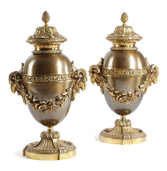 A PAIR OF GILT AND PATINATED BRONZE URNS IN LOUSI XVI STYLE