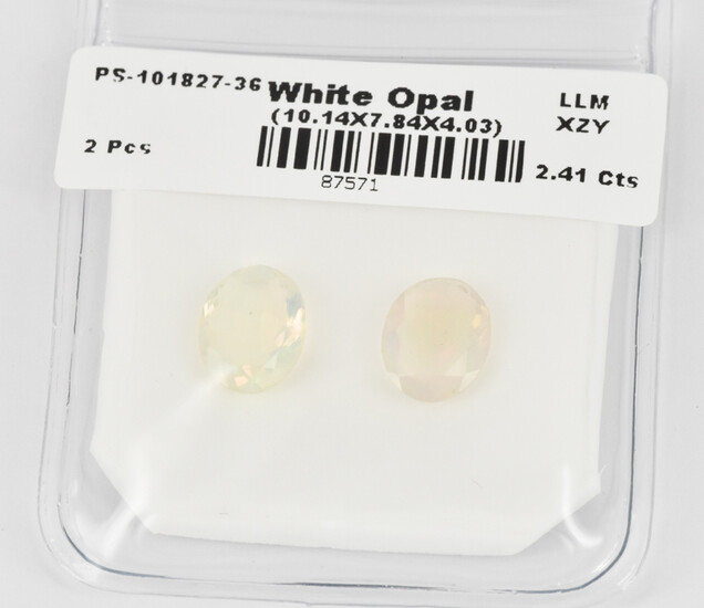 A PAIR OF LOOSE WHITE OPALS