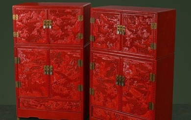 A PAIR OF MINIATURE CHINESE CINNABAR LACQUER CABINETS. Qing Dynasty, 18th / 19th Century. Each cabinet of rectangular form, with a smaller compartment above a larger one, opening to reveal a pair of small drawers, the doors all above a shallow drawer...