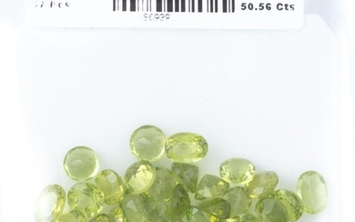 A PARCEL OF UNSET PERIDOTS; 57 round and oval cut gemstones totalling 50.56ct.