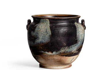 A 'PHOSPHATIC' GLAZED JAR WITH LUG HANDLES Tang dynasty
