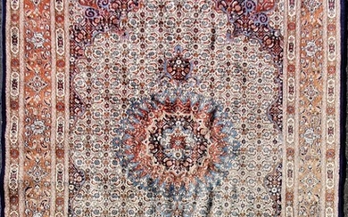 A RED AND BLUE FLORAL PATTERN CARPET