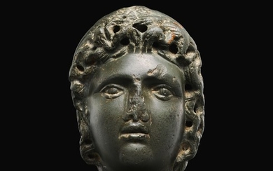 A ROMAN GRAYWACKE HEAD OF A YOUTH, CIRCA 2ND CENTURY A.D.