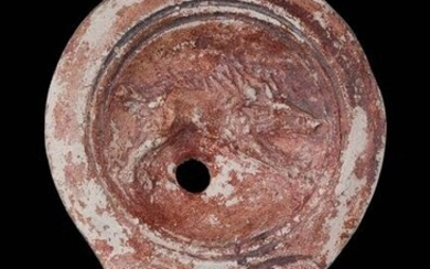 A ROMAN POTTERY OIL LAMP WITH BOAR