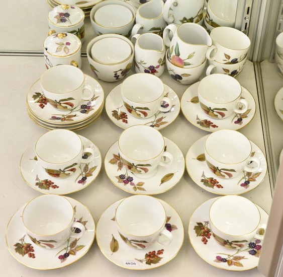 A ROYAL WORCESTER 'EVESHAM' TEA SET COMPRISING THIRTEEN CUPS AND TWELVE SAUCERS, MILK JUGS AND TWO SUGAR BOWLS