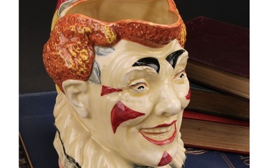 A Royal Doulton character jug, The Clown, designed by H. Fen...